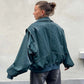 Woman wearing loose fashion lapel long sleeve zip-up jacket in dark green back view