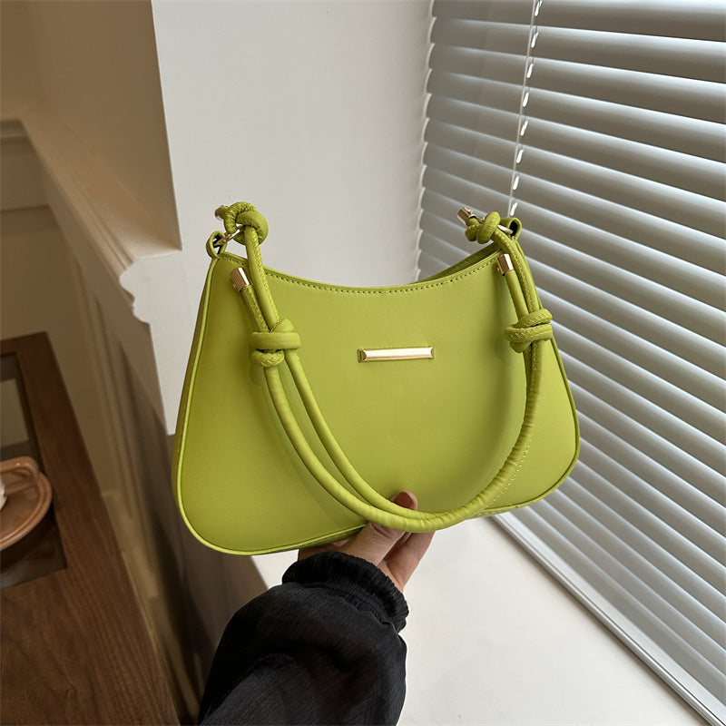 Women's high-end hand-held small square armpit bag in green PU material with knotted shoulder strap and gold accent detail