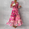 Woman wearing rose red long-sleeved floral print chiffon maxi dress with V-neck and pleated high waist