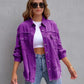 Woman wearing purple ripped shirt jacket with rolled sleeves and sunglasses, casual autumn spring top