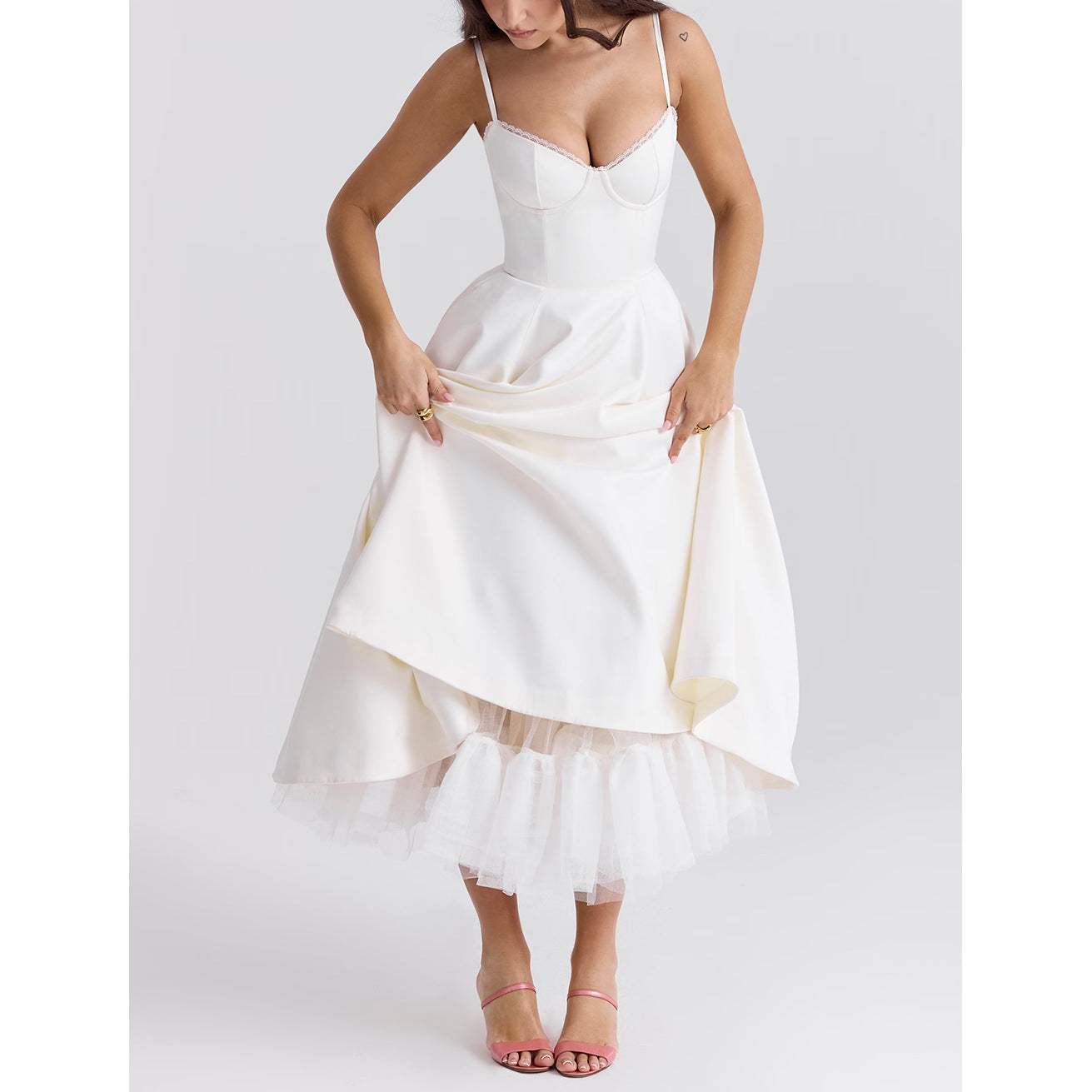 Woman wearing white V-neck brace sleeveless polyester long dress with high waist and puffy skirt
