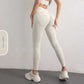 Women's high waist hip lift yoga leggings in light ivory with pockets for fitness and sports