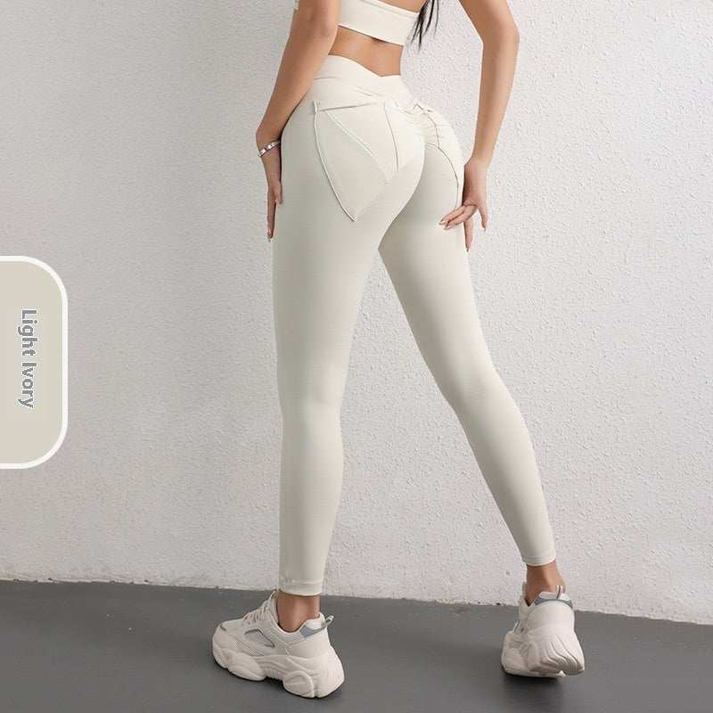 Women's high waist hip lift yoga leggings in light ivory with pockets for fitness and sports