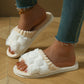 White new bow plush slippers with open toe and soft EVA sole worn indoors