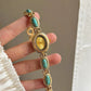 Women's agate bead bracelet watch with gold-tone alloy and turquoise stones, analog quartz movement