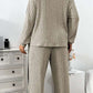 Woman wearing khaki ribbed polyester casual suit women's sweater with wide leg pants two-piece set