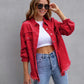 Women's red ripped shirt jacket worn with sunglasses and blue jeans, casual autumn spring top