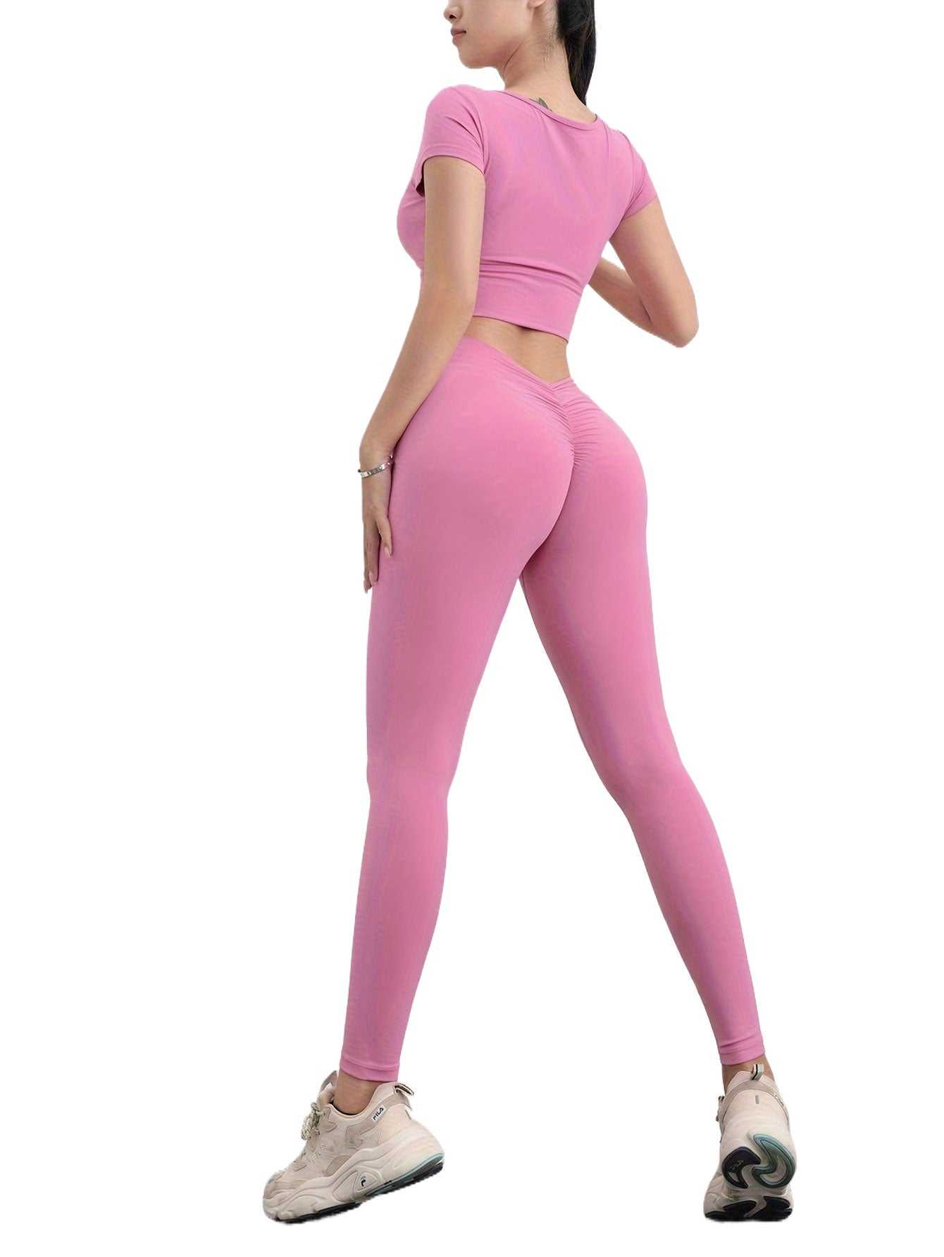 Woman wearing pink high waist seamless yoga pants with scrunch butt and elastic ultra-soft fit