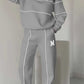 Gray women's 2 piece outfit lounge pullover sweatshirt and sweatpants with white stripes and pockets
