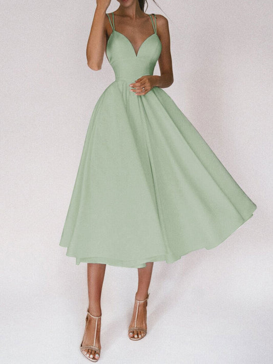 Woman wearing sexy V-neck suspender A-line summer dress in light green