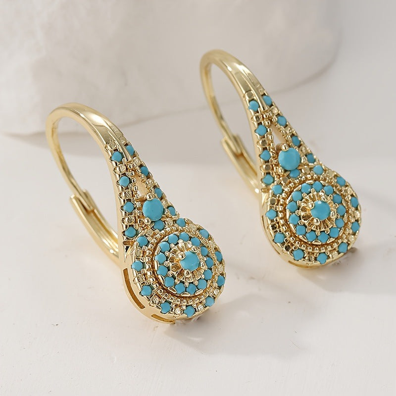 Gold alloy women's retro fashionable earrings with turquoise geometric design
