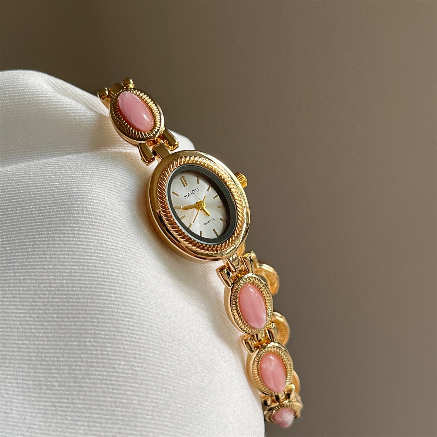 Women's agate bead bracelet watch with gold alloy analog design and pink stones