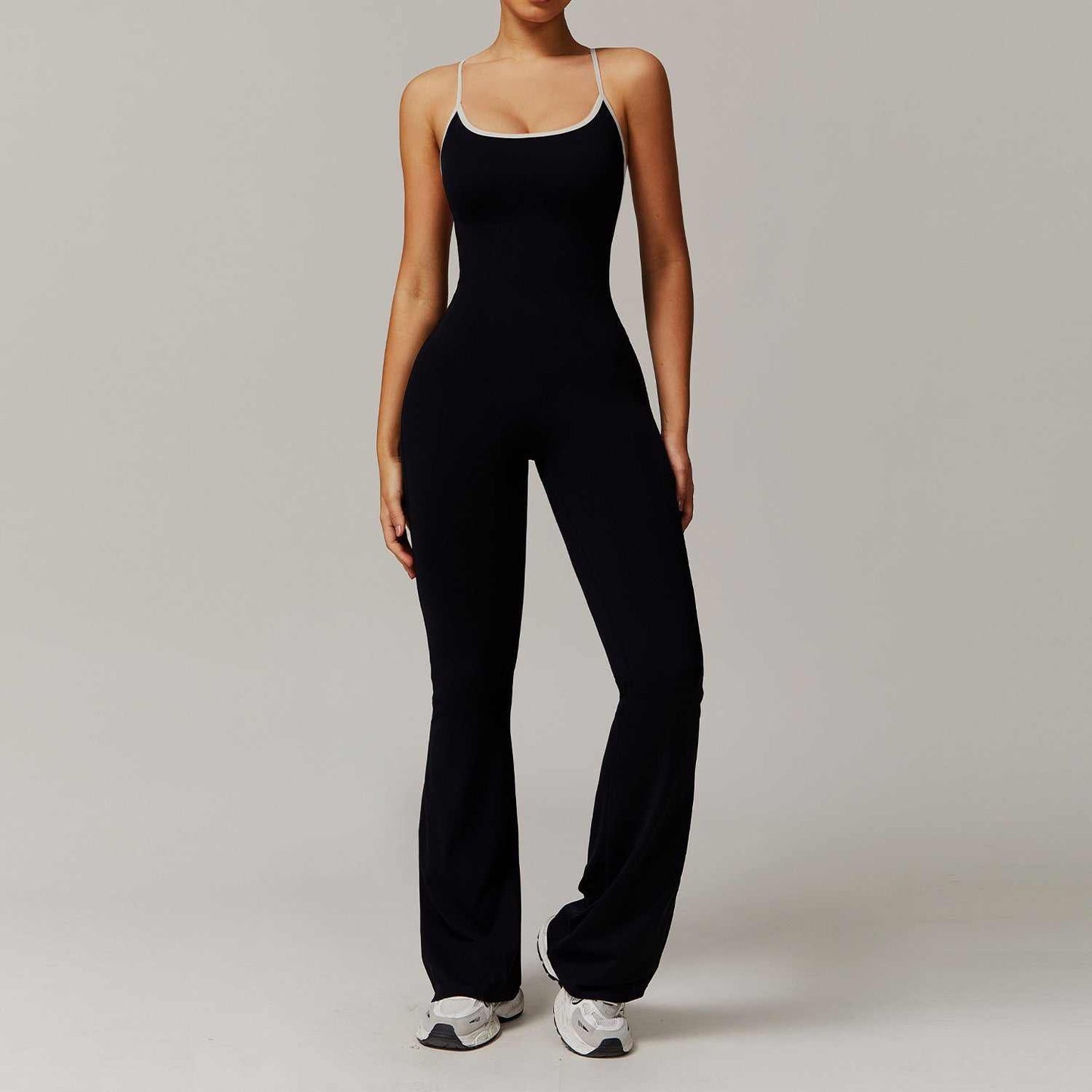 Solid Beauty-back black slim fit jumpsuit for women with breathable nylon fabric, ideal for yoga, fitness, running, and dance.