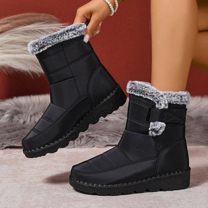 Plus size women's black snow boots with warm faux fur lining and flat sole.