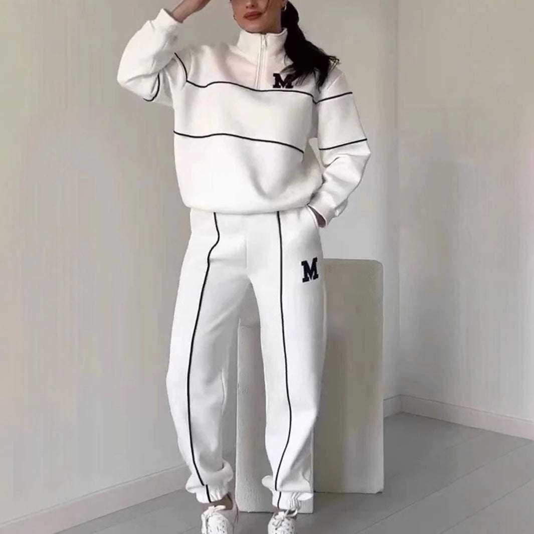 Women 2 piece white lounge sweatshirt and sweatpants set with black stripes and letter M design