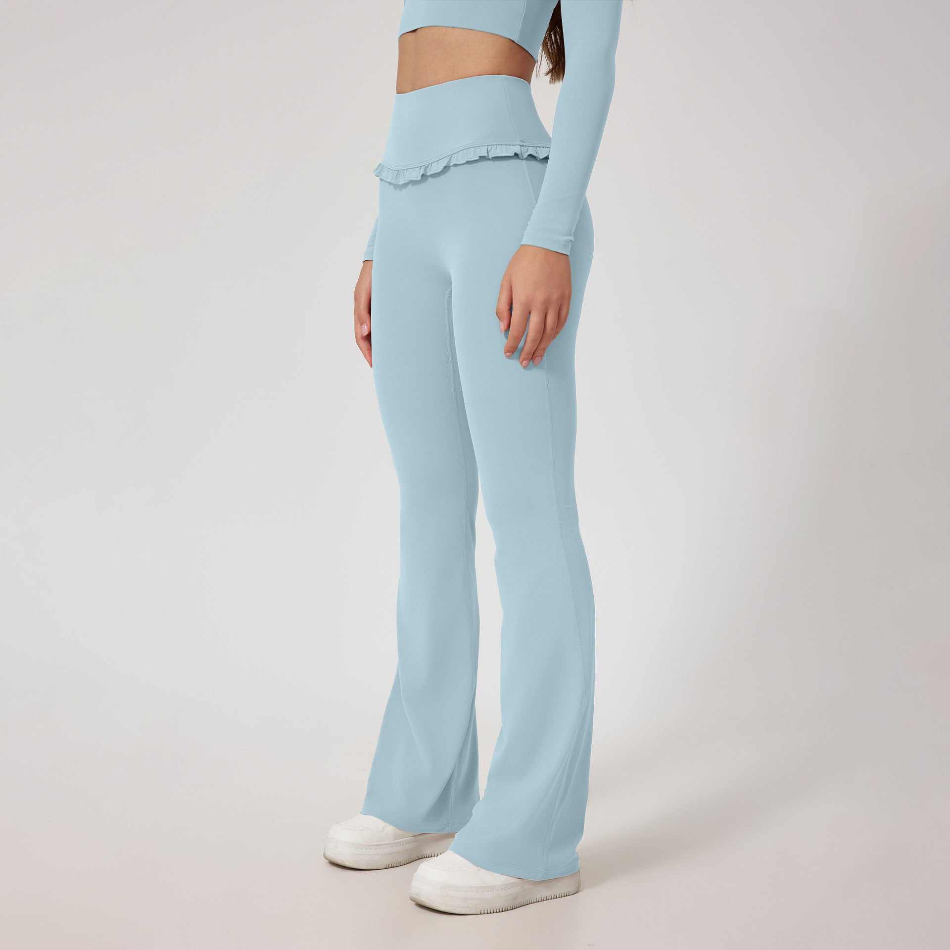 High waist hip lift yoga pants in pale blue with breathable nylon fabric and tight fit for running and fitness