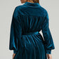 Back view of a woman wearing a blue green velvet long shirt dress with lapel collar and loose waist, Women's Gold Velvet Dress