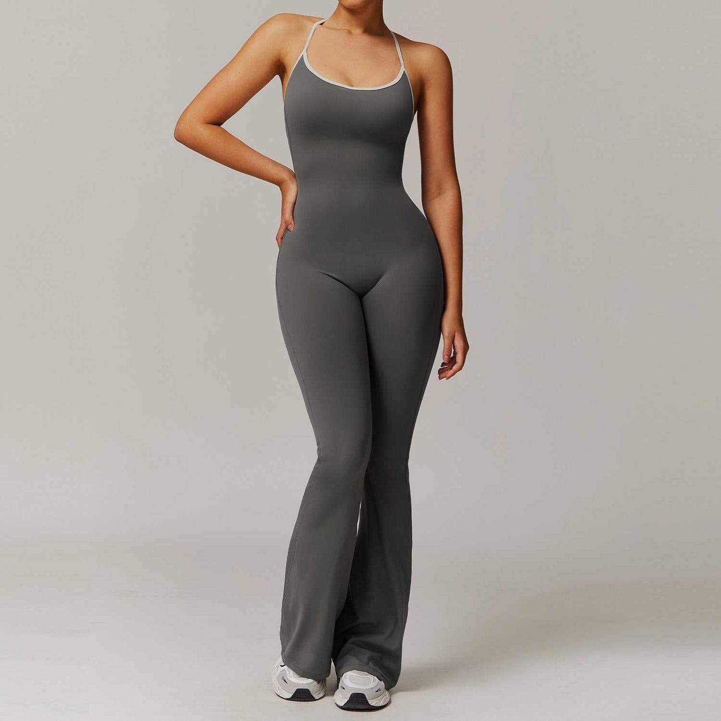 Women wearing Solid Beauty-back long pants jumpsuit in gray for yoga and fitness