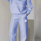 Women 2 piece lounge sweatpants and pullover sweatshirt set in light blue with white stripes and letter M design