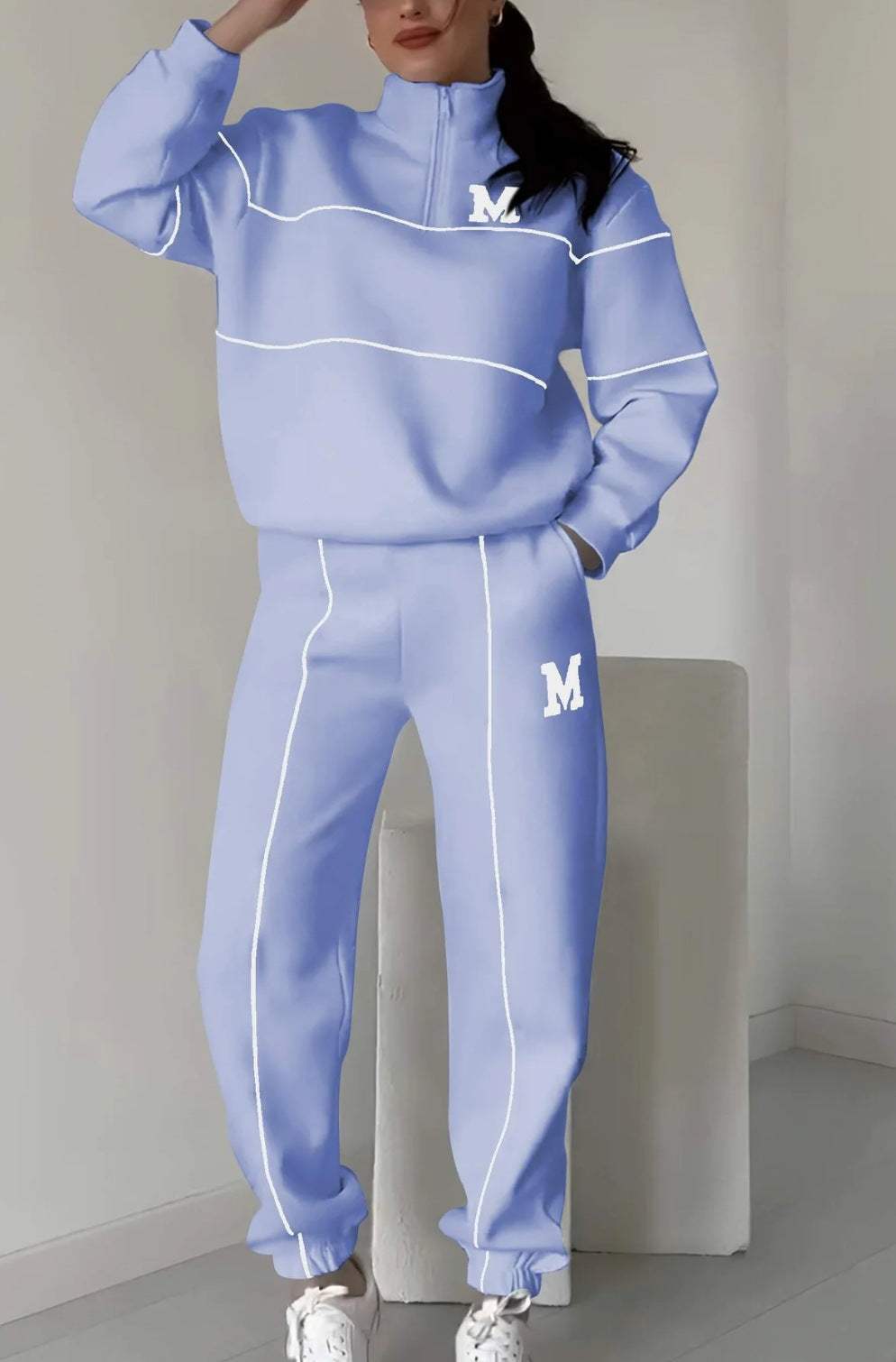 Women 2 piece lounge sweatpants and pullover sweatshirt set in light blue with white stripes and letter M design