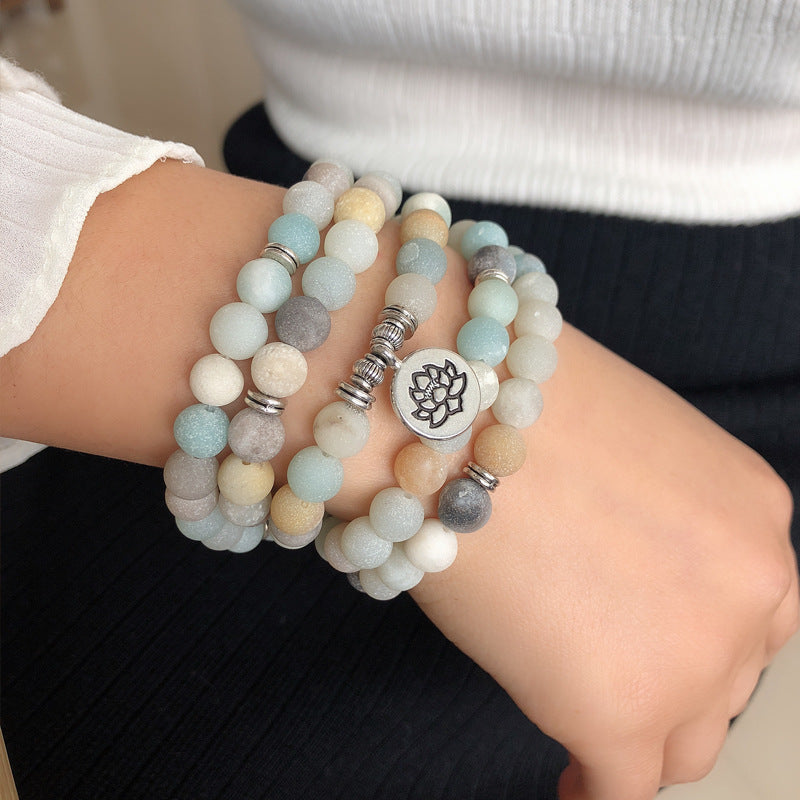 Handmade beaded frosted stone and alloy geometric succulent yoga bracelet on wrist