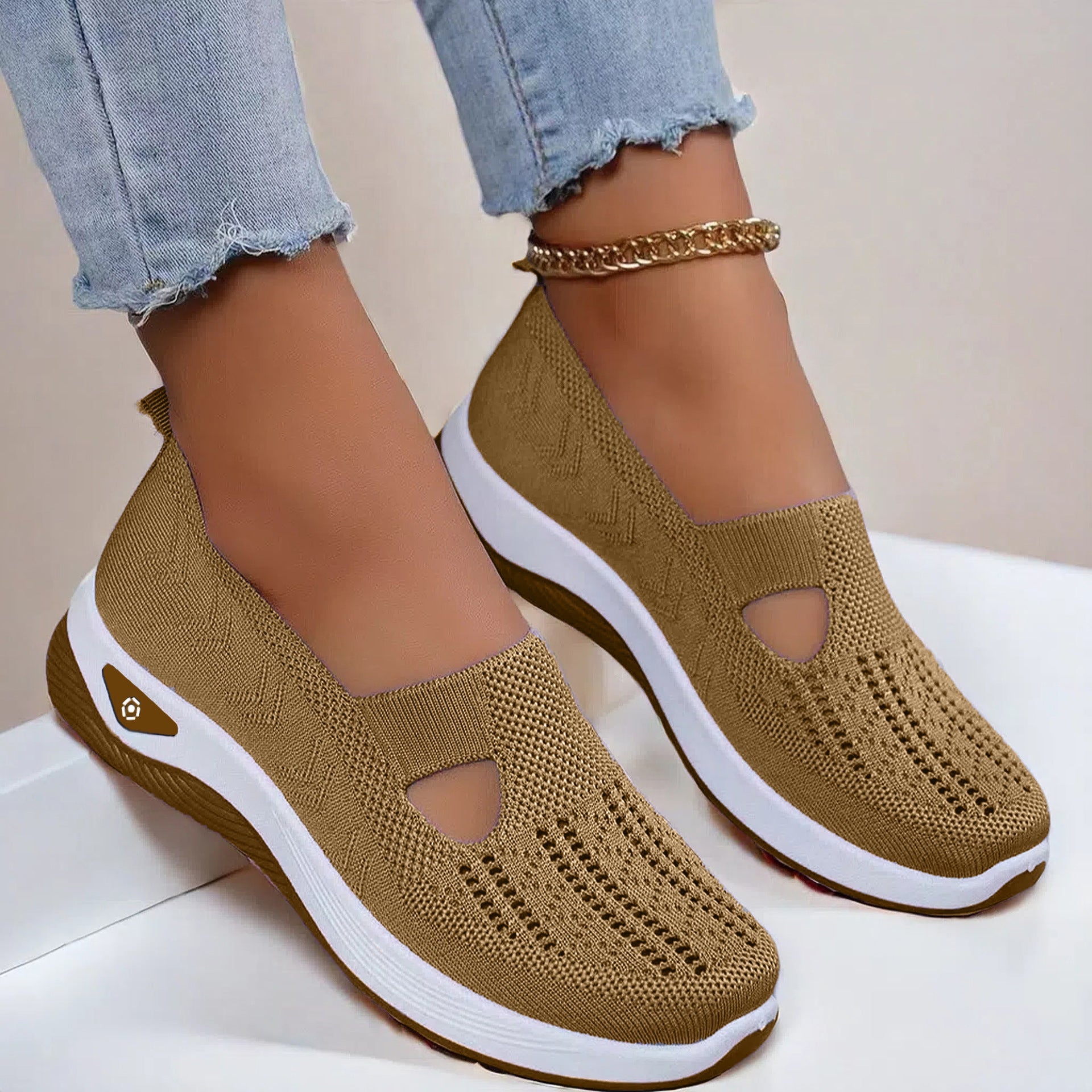 Women’s breathable mesh flats shoes in brown with white non-slip soft sole, casual style.